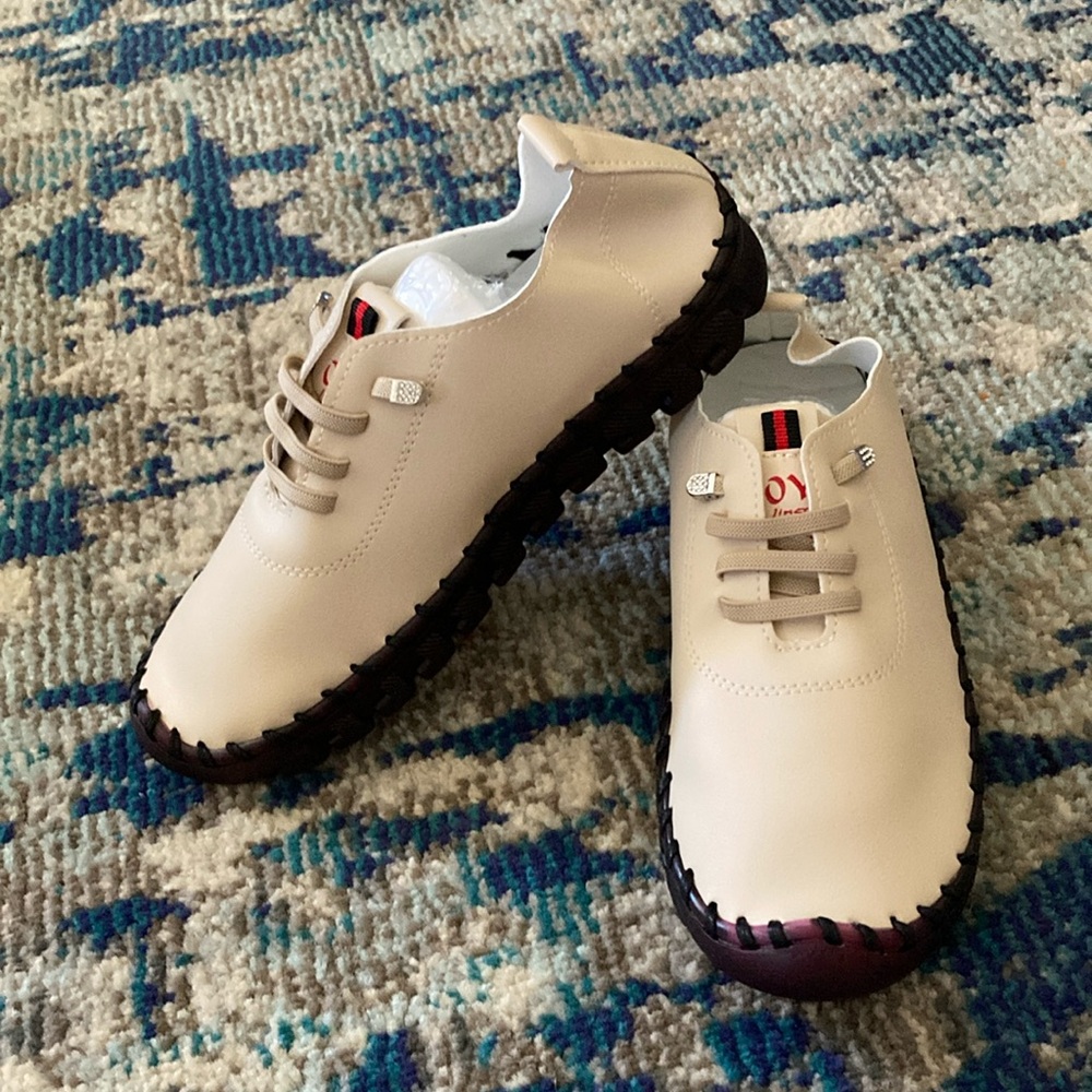 Tan slip on sneaker. NWT